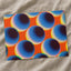 Blue Spheres Against a Vibrant Orange Matte Art Print (7 Sizes) - High Quality