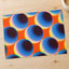 Blue Spheres Against a Vibrant Orange Matte Art Print (7 Sizes) - High Quality