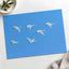 Flock of Geese Flying Through a Blue Sky by Zdeněk Macháček Photo Print Wall Decor