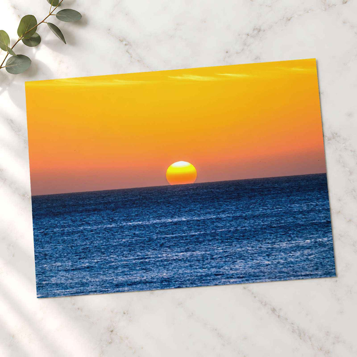 Low Sun on Horizon Above a Dark Blue Ocean Photo Wall Print (7 Sizes)