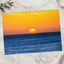 Low Sun on Horizon Above a Dark Blue Ocean Photo Wall Print (7 Sizes)