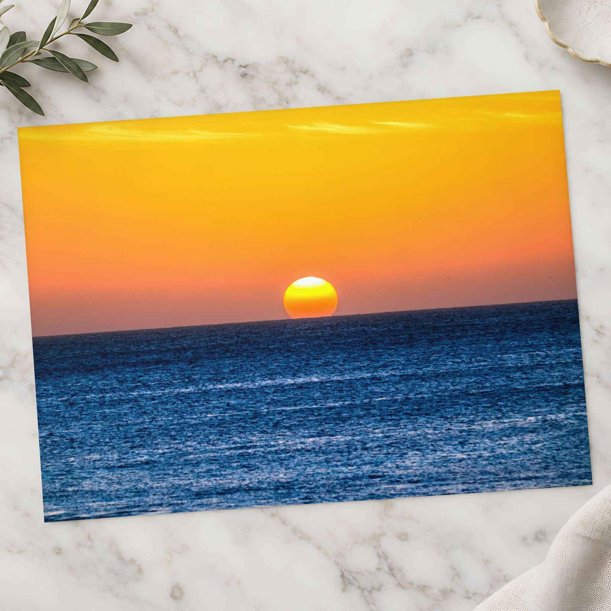Low Sun on Horizon Above a Dark Blue Ocean Photo Wall Print (7 Sizes)