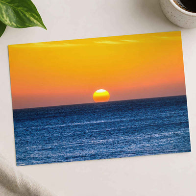 Low Sun on Horizon Above a Dark Blue Ocean Photo Wall Print (7 Sizes)