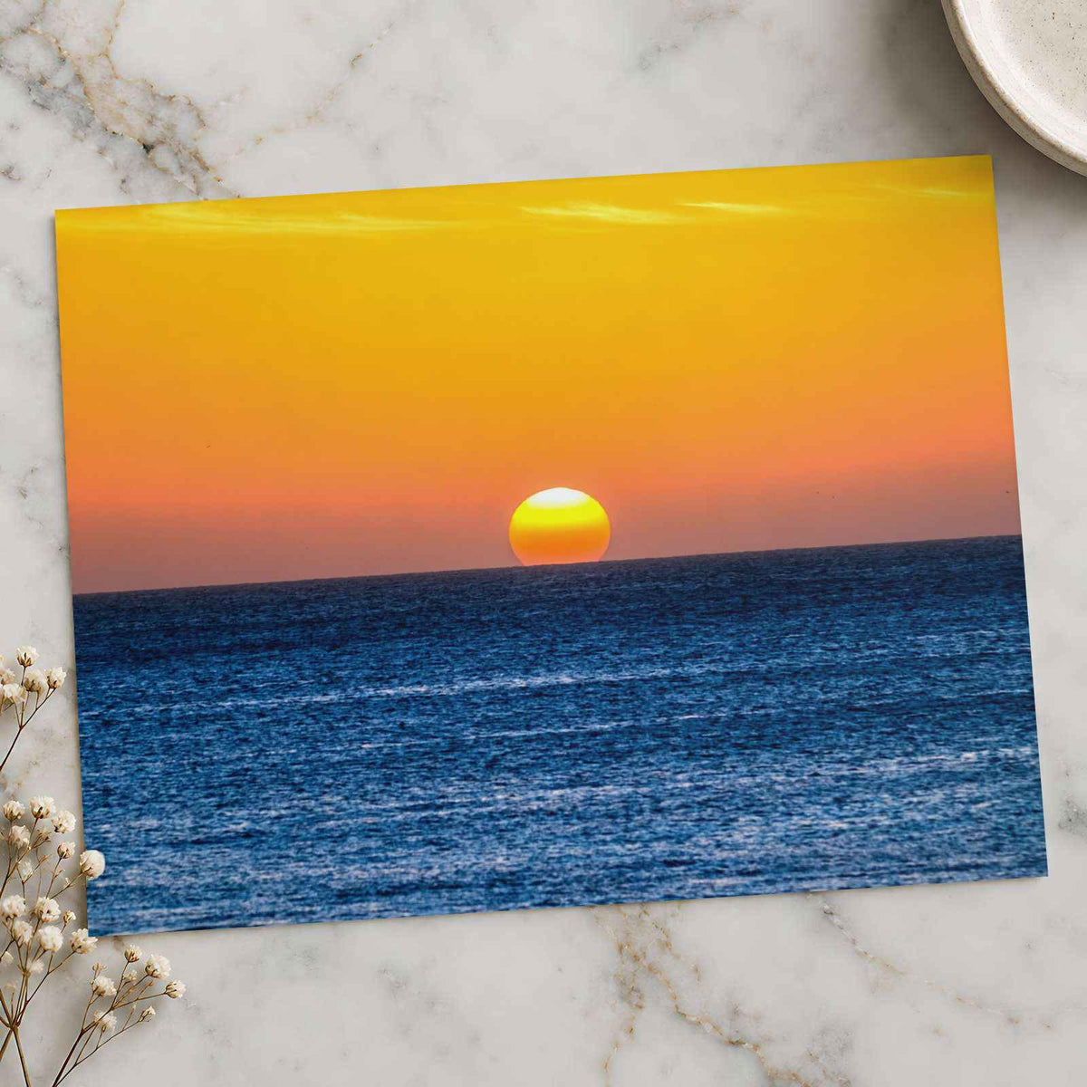 Low Sun on Horizon Above a Dark Blue Ocean Photo Wall Print (7 Sizes)