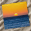 Low Sun on Horizon Above a Dark Blue Ocean Photo Wall Print (7 Sizes)
